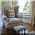 F07. Upholstered wing chair with matching footstool. 41"h x 35"w x 32"d 